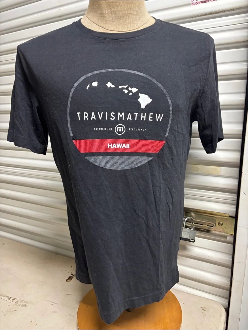 Travis Mathew Black Graphic Hawaii Short-Sleeve Tee with Red Accent